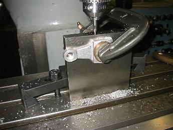  Drilling the clamping holes in the crank with a favorite setup - angle place, locating plug (under the clamp) and C-clamp.